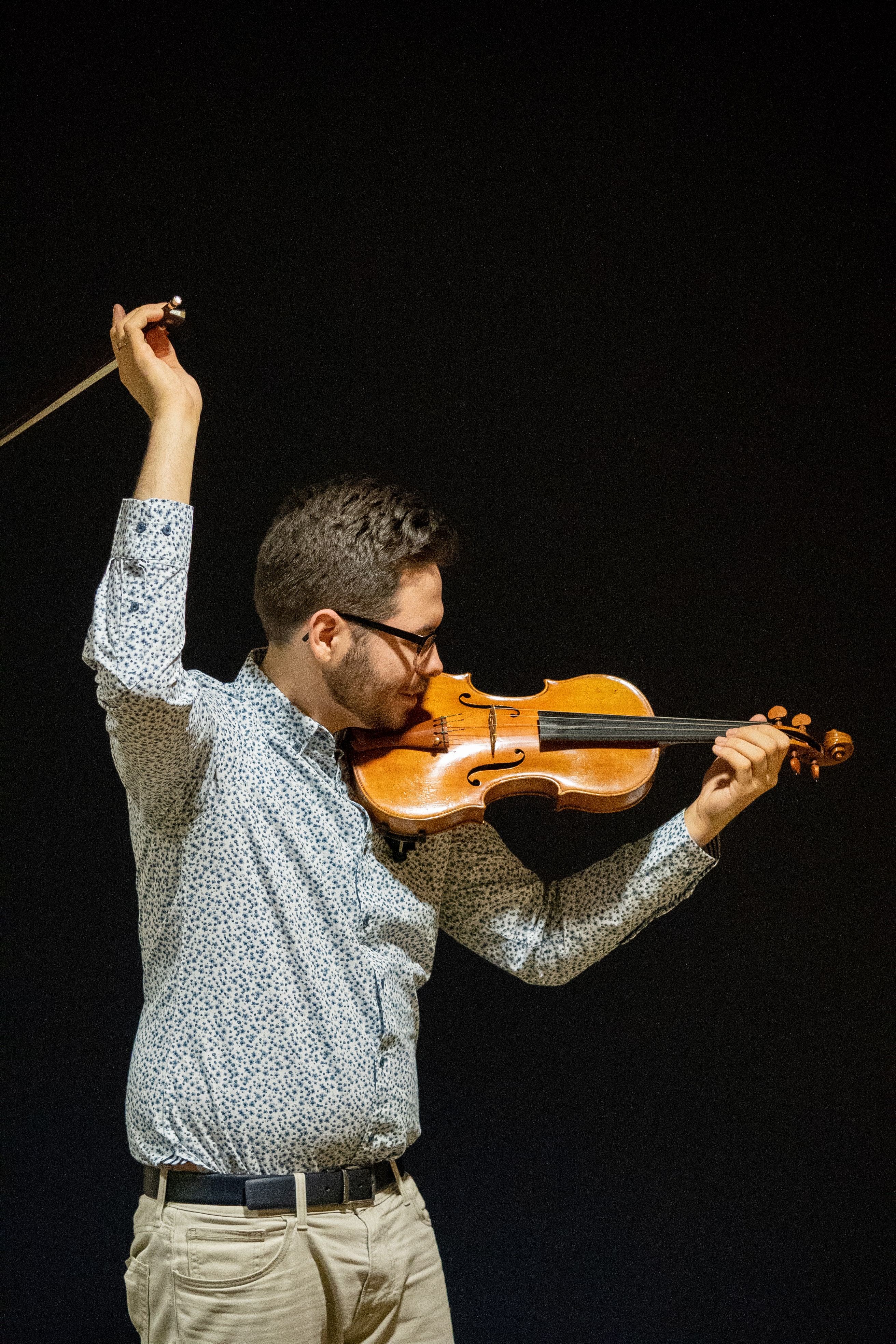 Mike's bow is flying off the string in a dramatic swoosh!